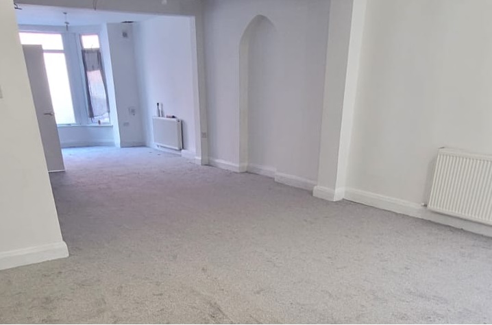An empty carpeted room in Ihsan Youth’s first family centre